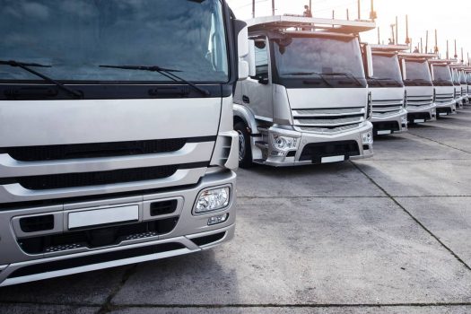 Group of trucks parked in a row.